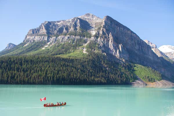 Scenic panoramic view of the turquoise waters of Lake Louise in Banff National Park, Canada during Canada Day.
