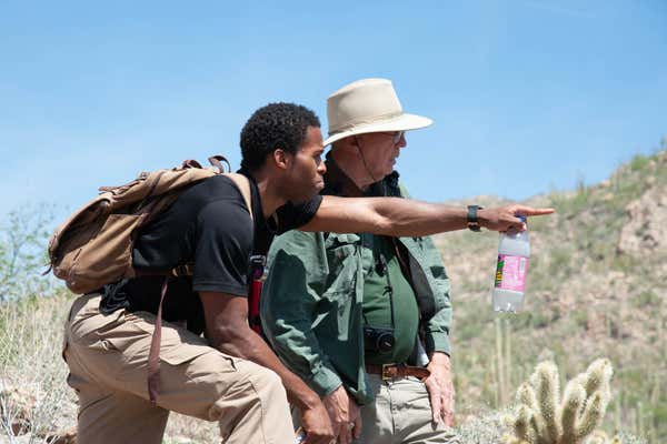 View of geologists on location in Arizona on the North east Arizona geology tour, USA