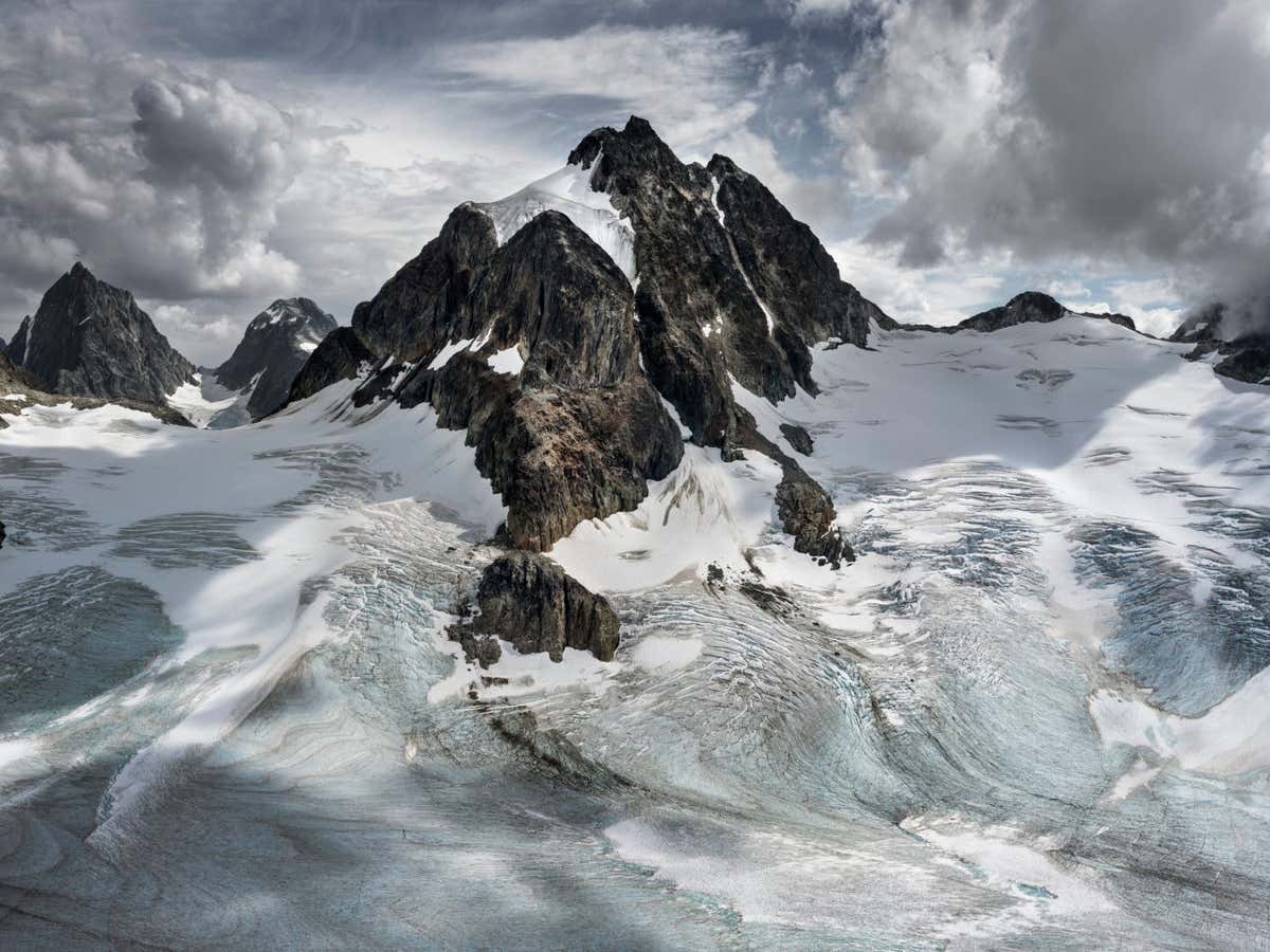 Coast Mountains #16, British Columbia, Canada, 2023 "Recent reports on the world's remaining glaciers provide sobering news. Estimates are that most of Western Canada's glaciers will be lost to melting within the next 80 years. By the end of this century, they could all be gone. My daughters, who are in their 20s, will not be looking at the same world when they are my age. These images are a reminder of what's being lost - relics of ancient ice and an essential resource for ecosystems and freshwater in these parts of the world