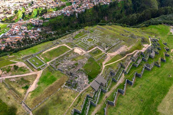 Aerial top view of the inca ruins of Sacsayhuaman on the outskirts of Cusco, Peru. Archaeological site of ancient Incan citadel.