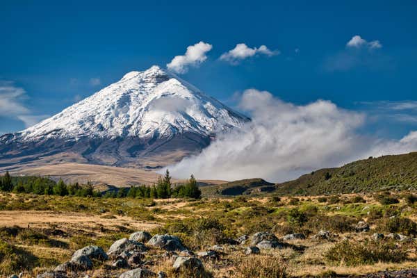Cotopaxi volcano with a distinct plume of smoke in the national park