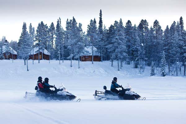 Sweden Lapland snow mobiling near Ice Hotel, arctic tundra, Sweden